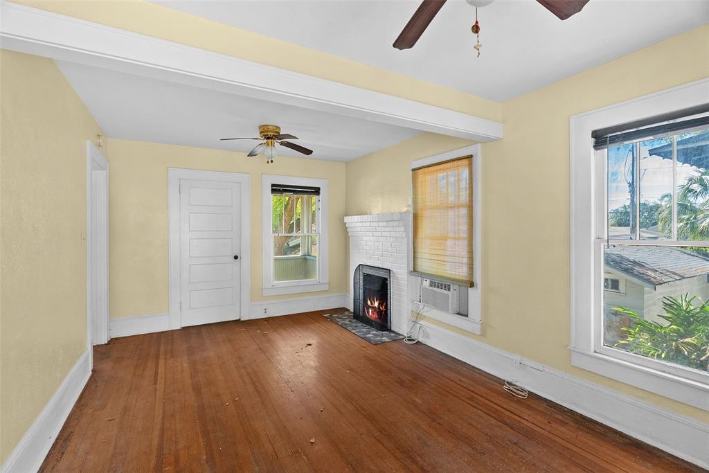 300 President Street Dunedin, FL 34698 - Photo 19 of 53 wooden floor in an empty room with a window