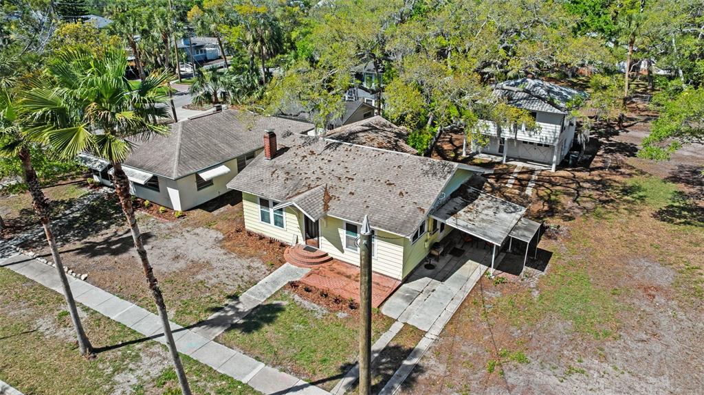 300 President Street Dunedin, FL 34698 - Photo 2 of 53 a view of a patio with table and chairs with wooden fence and floor