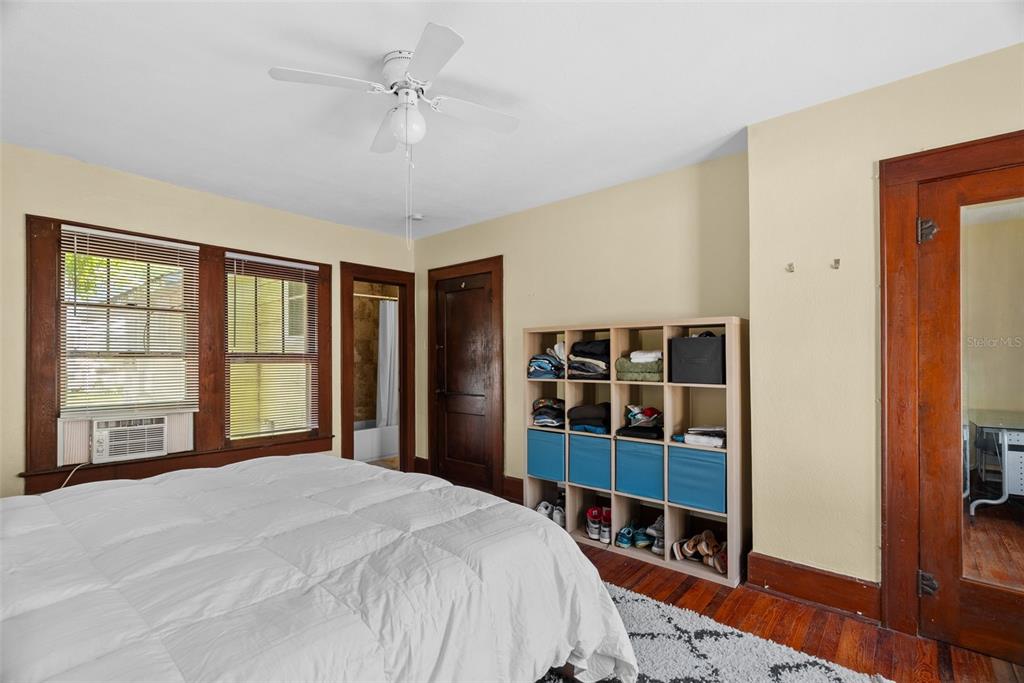 300 President Street Dunedin, FL 34698 - Photo 22 of 53 a bedroom with a large bed and a window