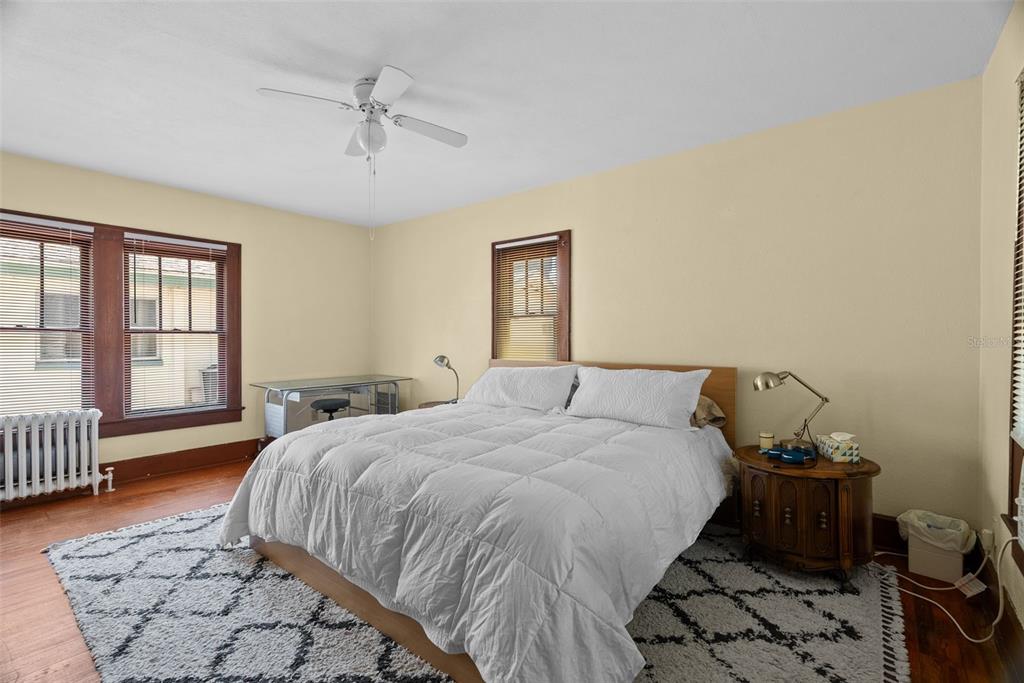 300 President Street Dunedin, FL 34698 - Photo 27 of 53 a bedroom with a bed and wooden floor