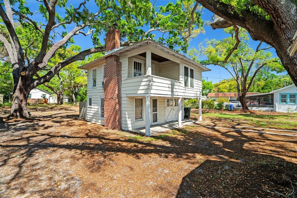 300 President Street Dunedin, FL 34698 - Photo 28 of 53 a front view of a house with a yard