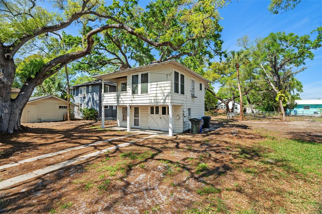 300 President Street Dunedin, FL 34698 - Photo 30 of 53 a view of a house with a tree in front