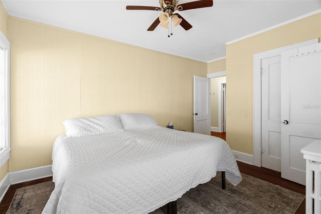 300 President Street Dunedin, FL 34698 - Photo 42 of 53 a bedroom with a bed and cabinets