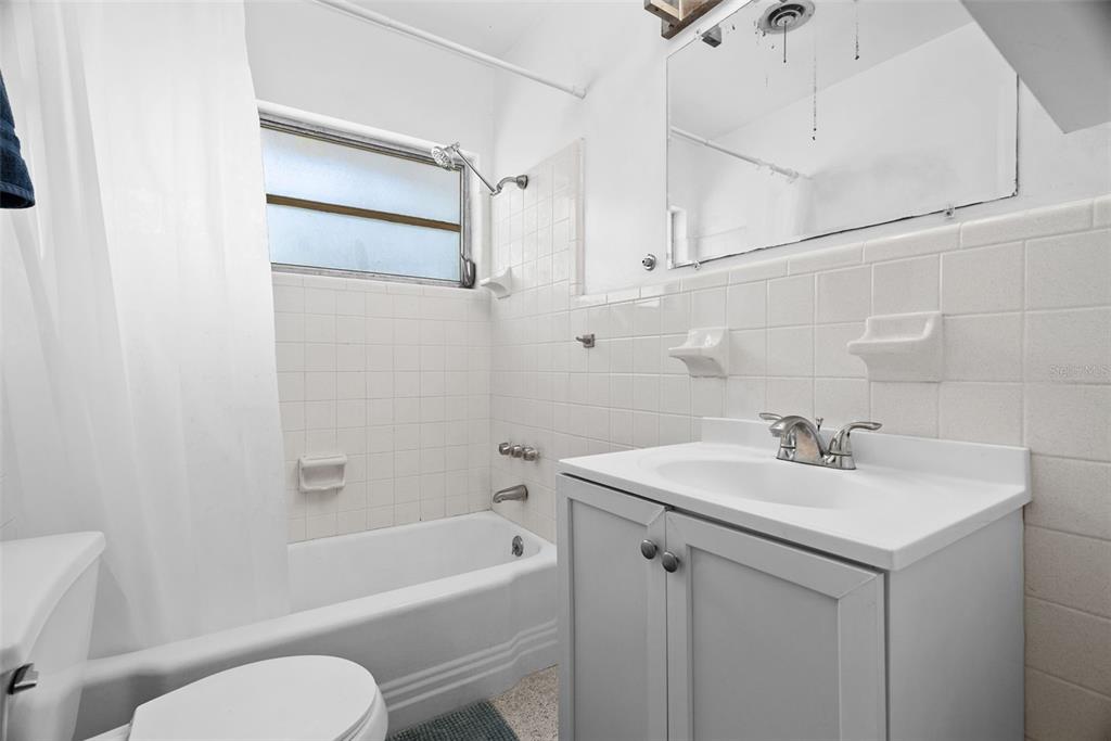 300 President Street Dunedin, FL 34698 - Photo 44 of 53 a bathroom with a sink toilet and shower