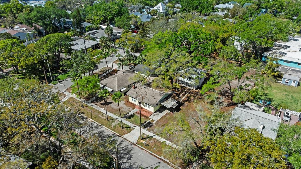 300 President Street Dunedin, FL 34698 - Photo 48 of 53 an aerial view of residential house with parking and yard