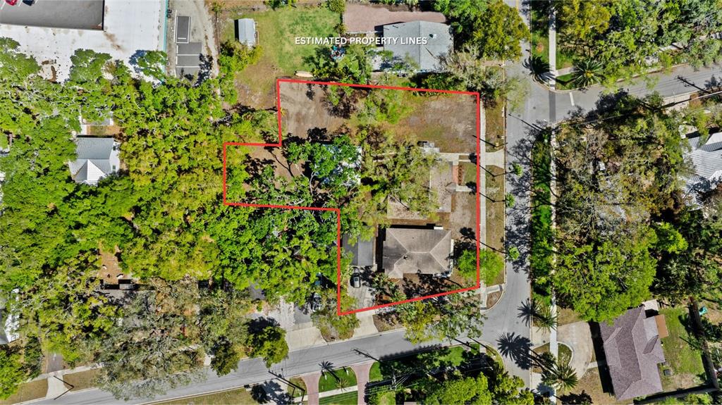 300 President Street Dunedin, FL 34698 - Photo 50 of 53 an aerial view of a house with a yard and garden