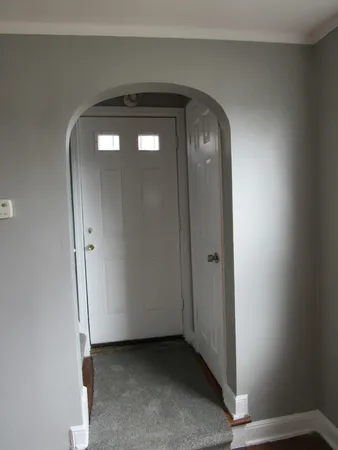 an empty room with mirror