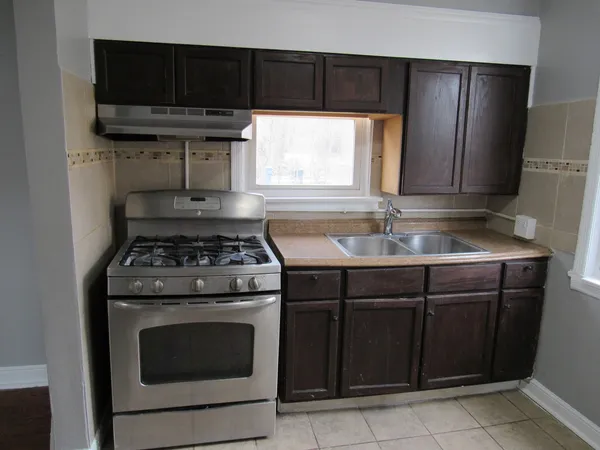 a kitchen with a stove and a microwave
