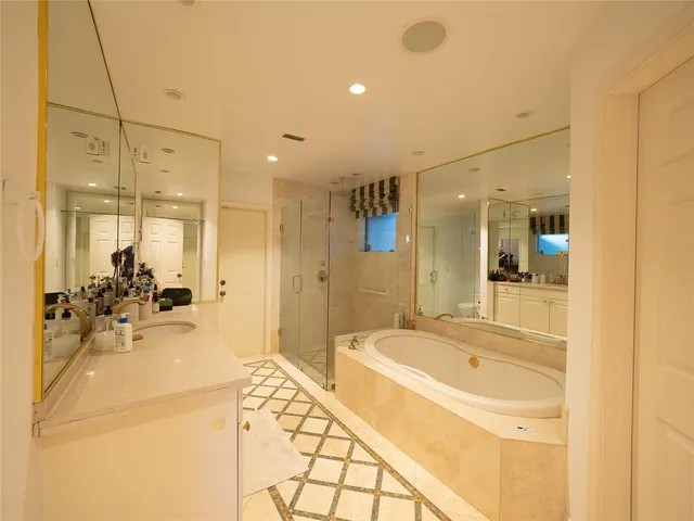 a bathroom with a bathtub and a sink