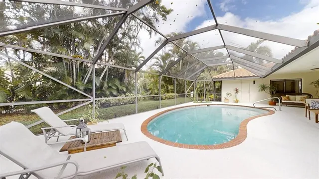 a view of a swimming pool with a patio