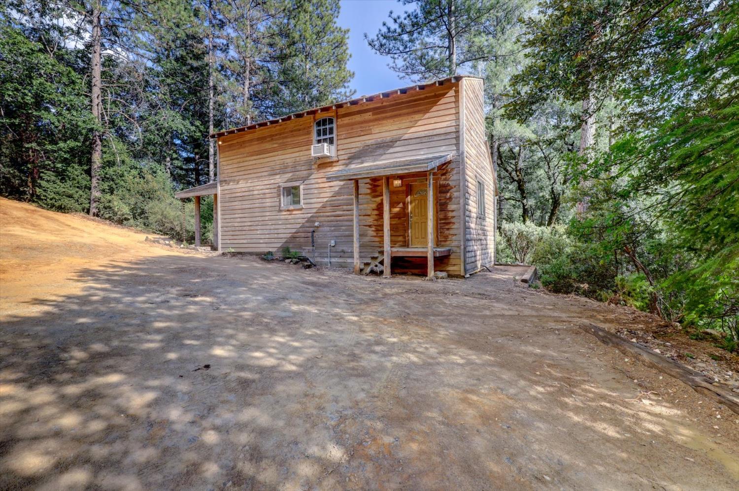19455 Hogback Road Nevada City, CA 95959 - Photo 25 of 87 a view of house with backyard and wooden fence