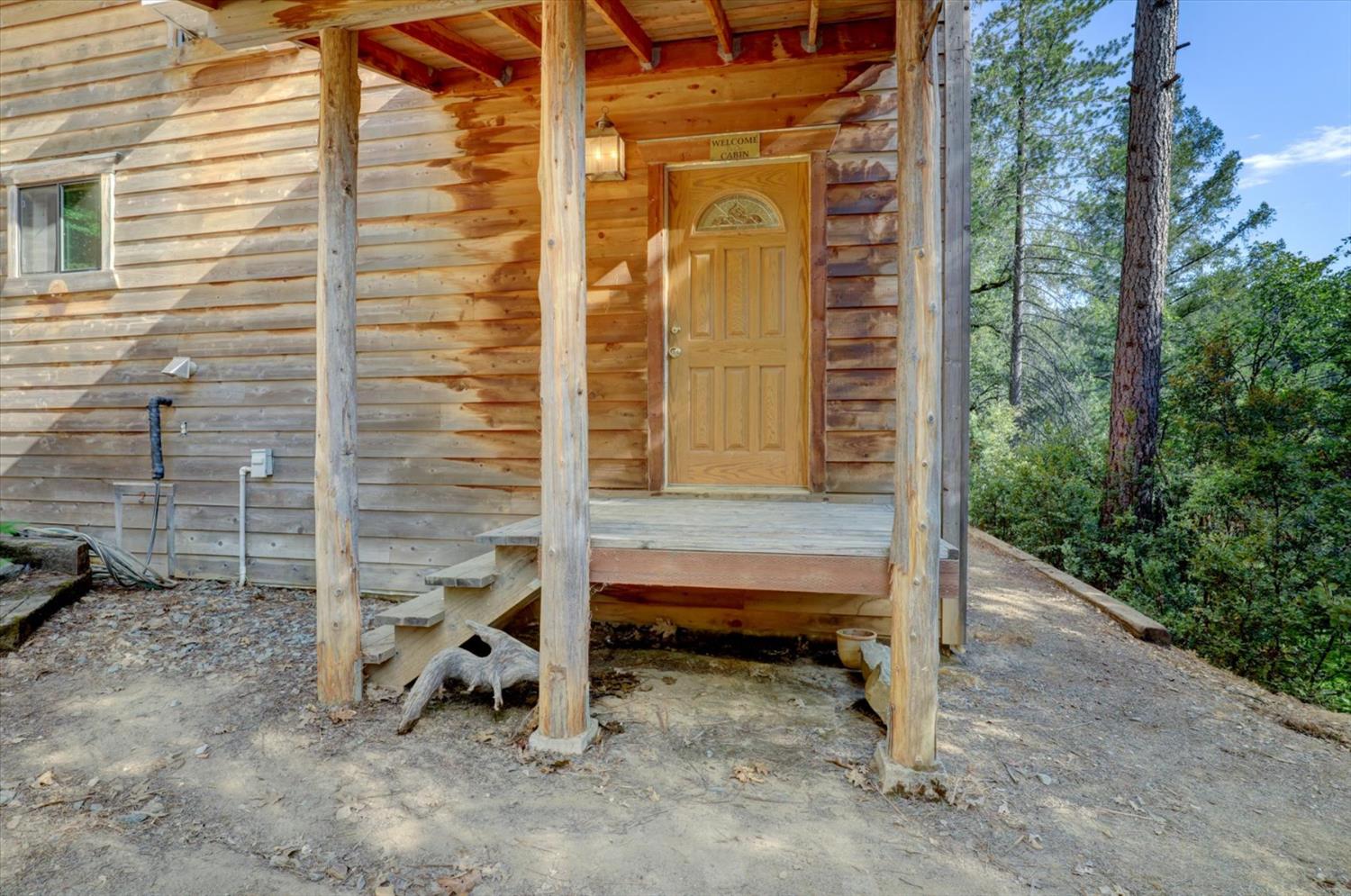 19455 Hogback Road Nevada City, CA 95959 - Photo 26 of 87 a view of backyard with tub and trees in the background