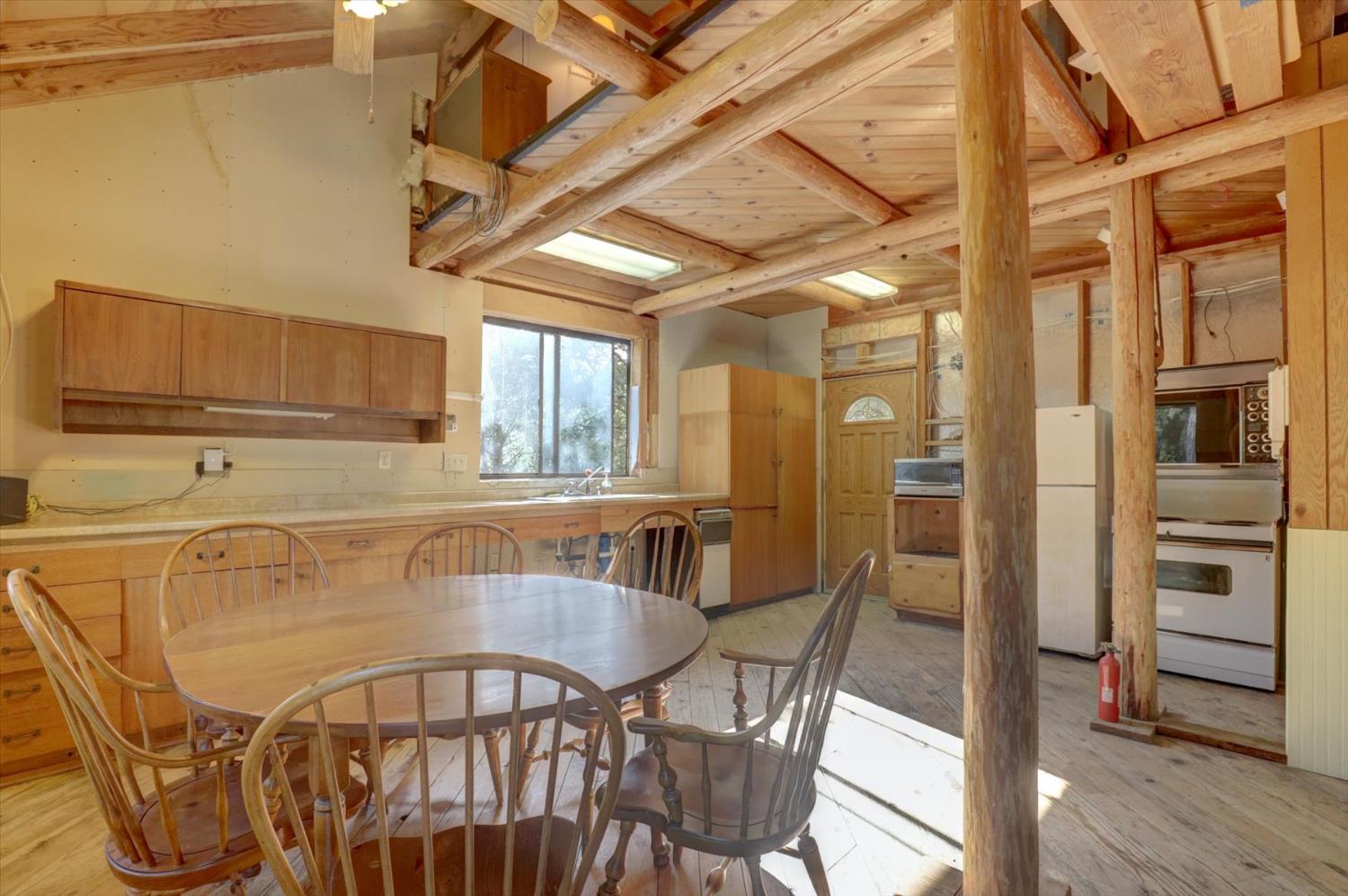 19455 Hogback Road Nevada City, CA 95959 - Photo 31 of 87 a view of a dining room with furniture and wooden floor