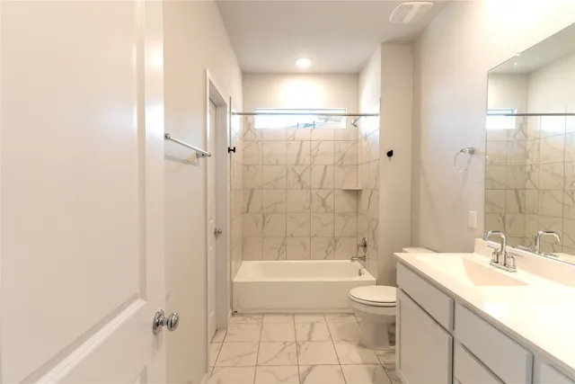 a bathroom with a sink toilet and a mirror