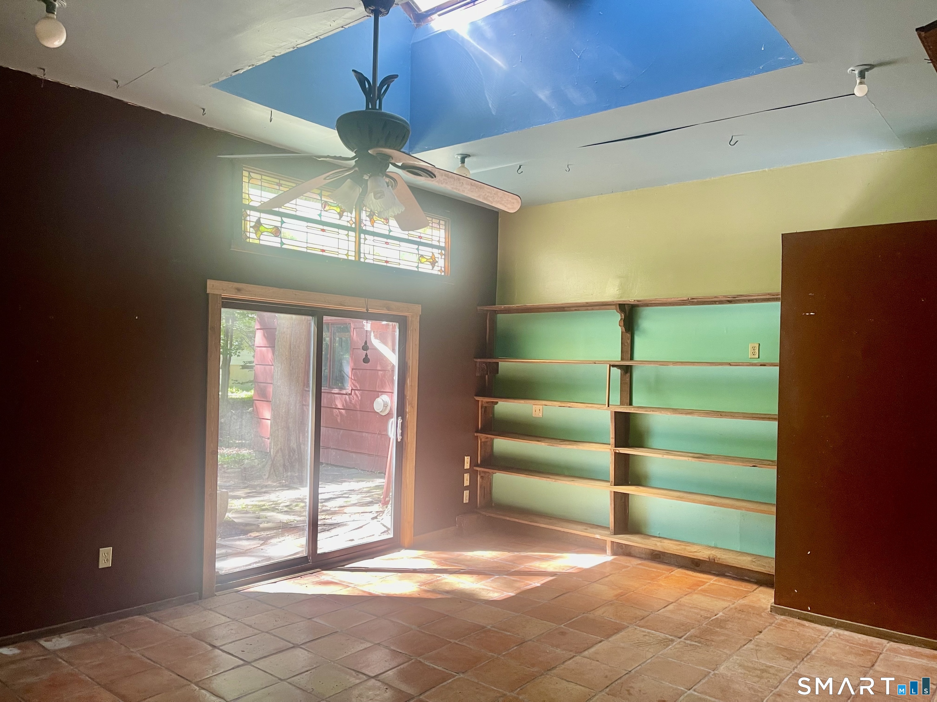 11 Tubbs Spring Drive Weston, CT 06883 - Photo 26 of 36 Once the garage, now a room with many possibilities, with skylight, slider & Dutch door