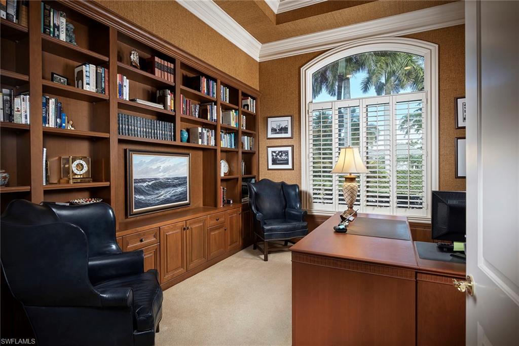 1626 Chinaberry Way Naples, FL 34105 - Photo 11 of 35 a living room with furniture and a flat screen tv