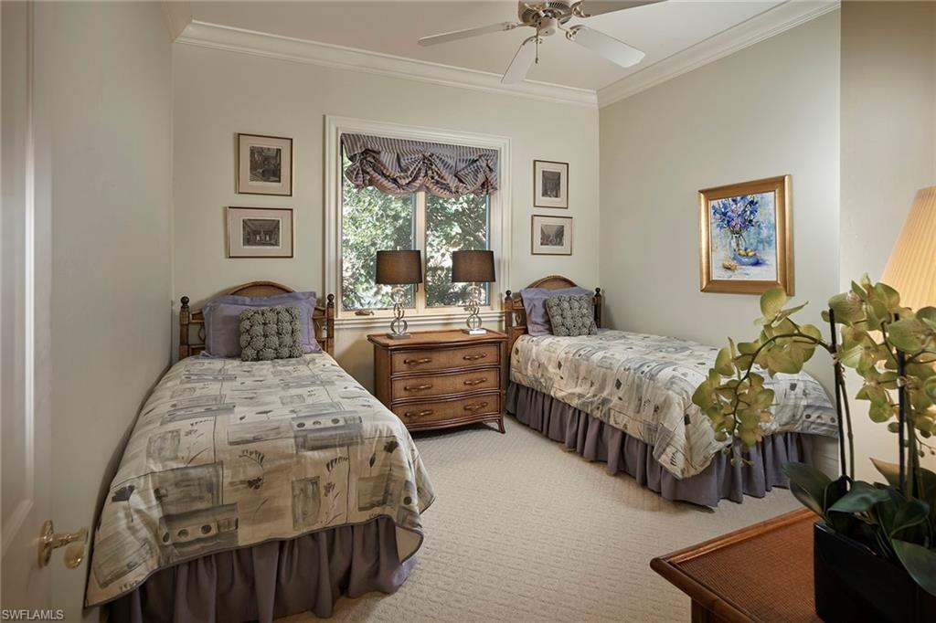 1626 Chinaberry Way Naples, FL 34105 - Photo 23 of 35 a bedroom with two beds and a large window