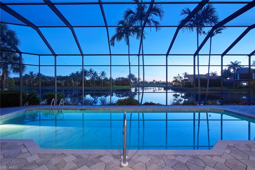 1626 Chinaberry Way Naples, FL 34105 - Photo 3 of 35 a room with lots of wooden cabinets