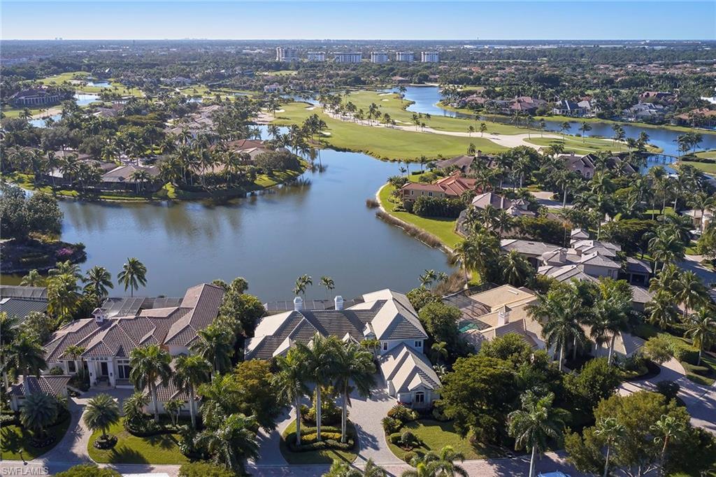 1626 Chinaberry Way Naples, FL 34105 - Photo 33 of 35 an aerial view of residential houses with outdoor space and lake view