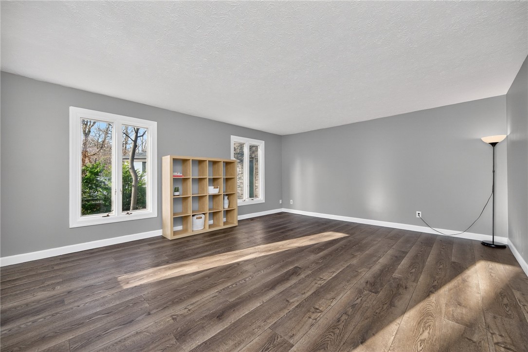 4747 Fawnwood Road Dayton, OH 45429 - Photo 9 of 58 Bright and airy living area featuring rich wood flooring and ample natural light.