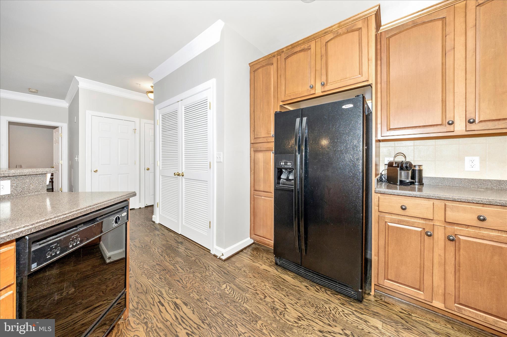 35 East All Saints Street, Unit 114 Frederick, MD 21701 - Photo 13 of 37 a kitchen with stainless steel appliances granite countertop a refrigerator and a stove top oven
