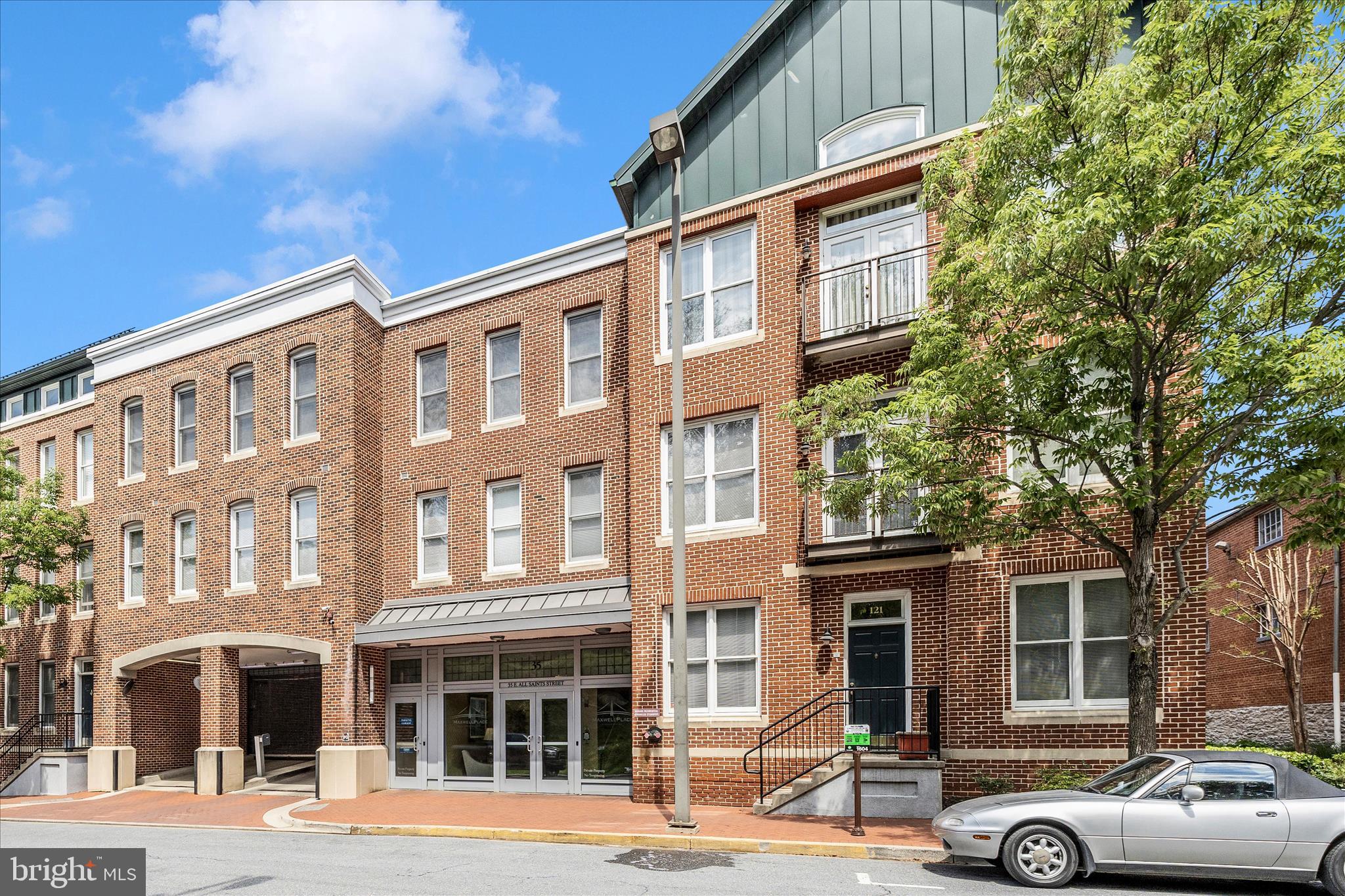 35 East All Saints Street, Unit 114 Frederick, MD 21701 - Photo 24 of 37 a front view of a building with parking space