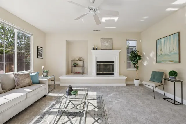 a view of a dining room with furniture a chandelier and wooden floor