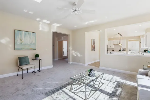a view of a dining room with furniture wooden floor and a chandelier