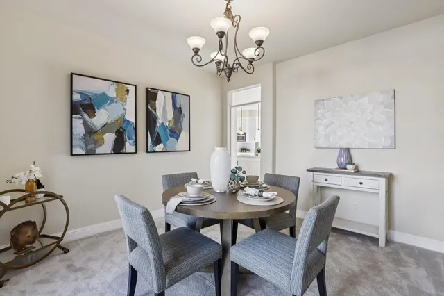 a kitchen with kitchen island a sink stainless steel appliances and cabinets