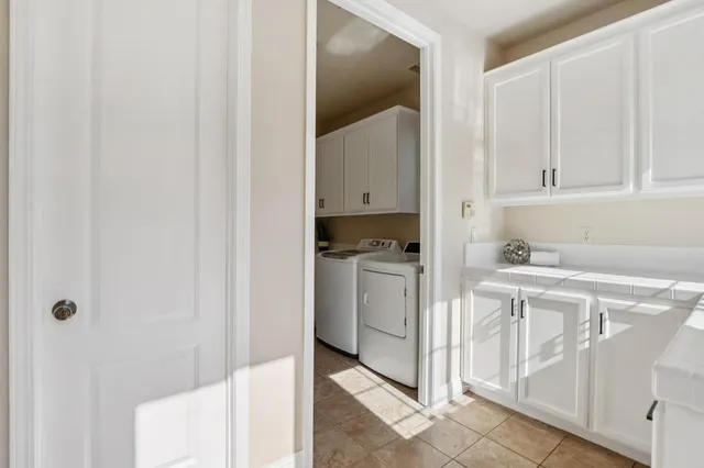 a bathroom with a shower and a glass door
