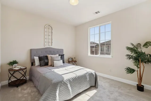 a living room with furniture a window and a table
