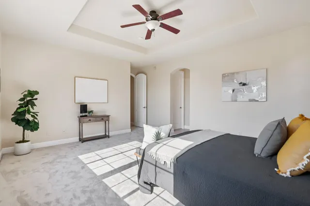 an aerial view of a house with a yard and potted plants
