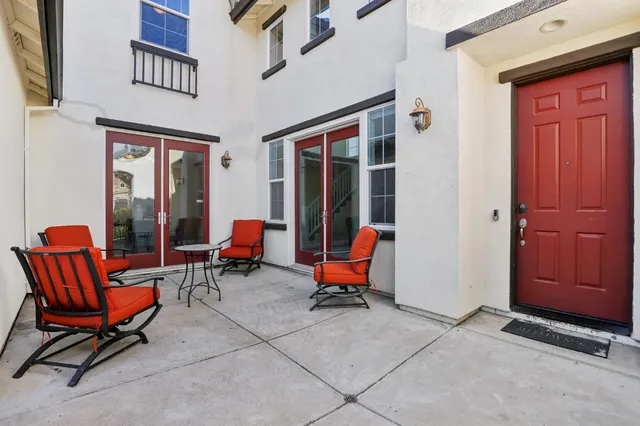 a view of living room with furniture and windows