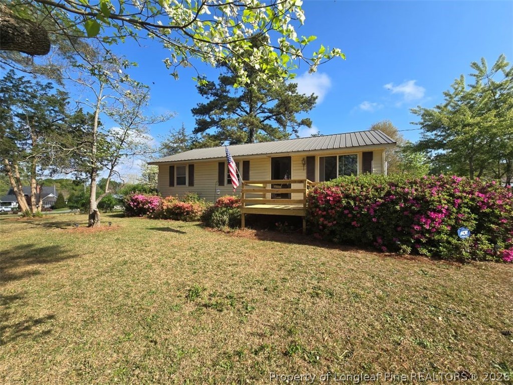 a front view of a house with yard