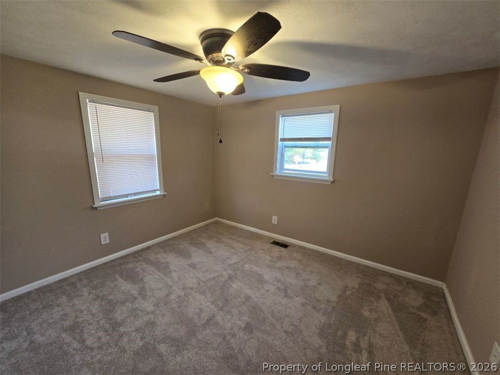 219 East Clinton Street Autryville, NC 28318 - Photo 11 of 32 a view of an empty room with a window