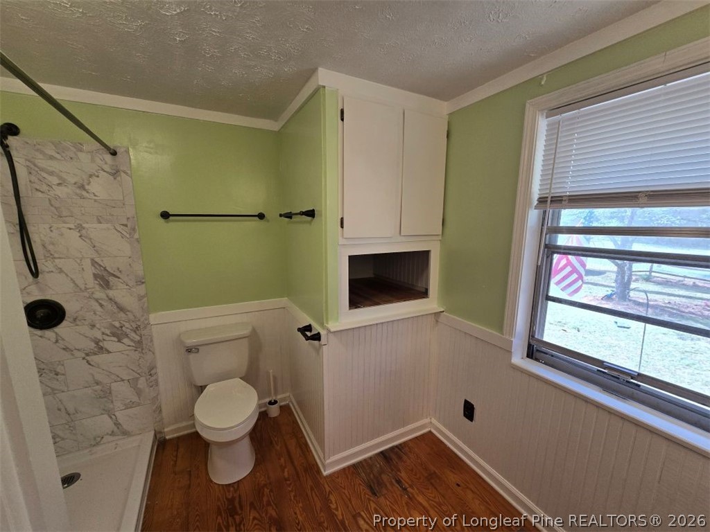 219 East Clinton Street Autryville, NC 28318 - Photo 16 of 32 a bathroom with a toilet and a shower