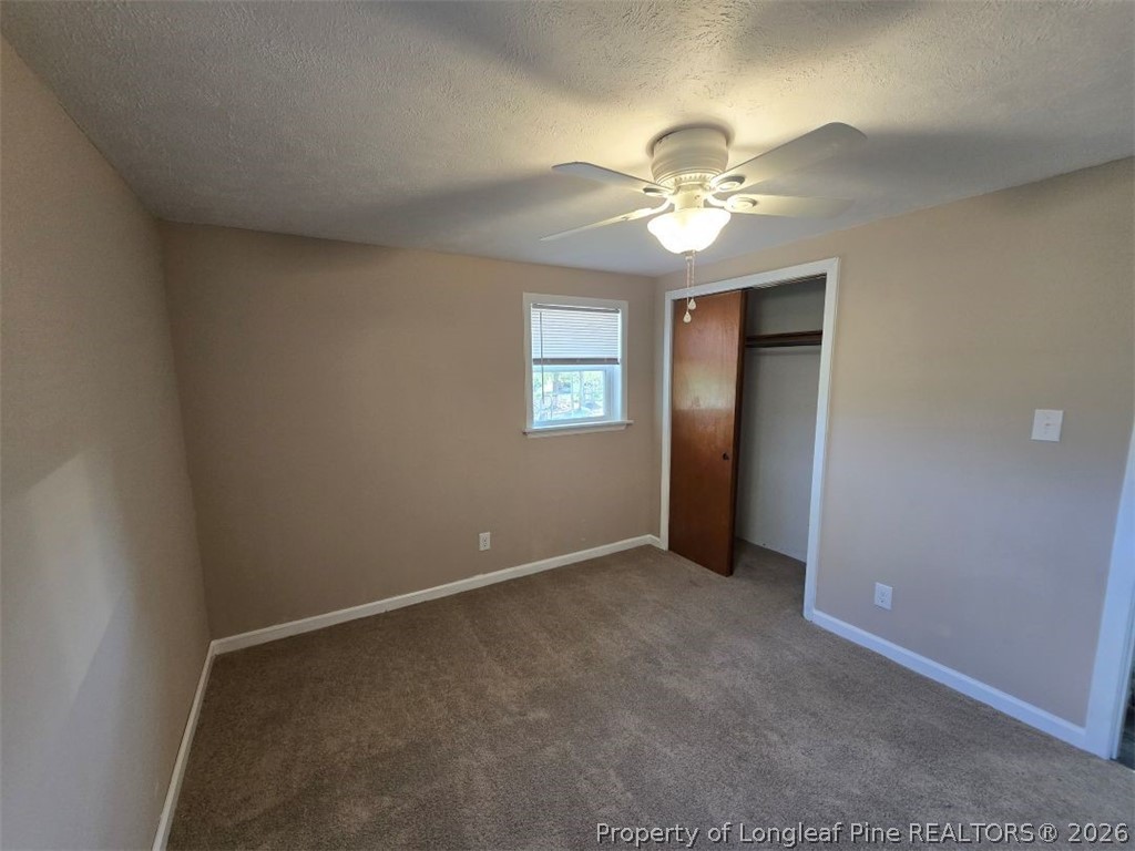 219 East Clinton Street Autryville, NC 28318 - Photo 19 of 32 a view of an empty room with a window