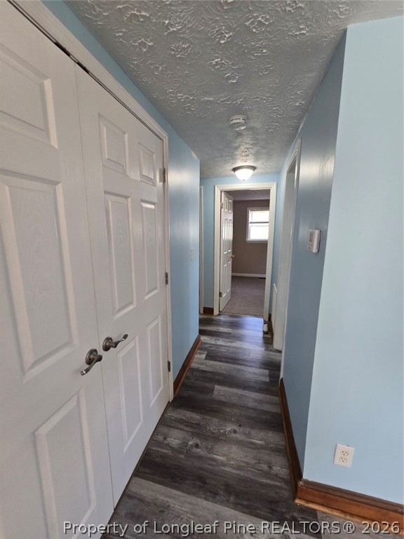 219 East Clinton Street Autryville, NC 28318 - Photo 25 of 32 a view of a hallway with wooden floor and staircase
