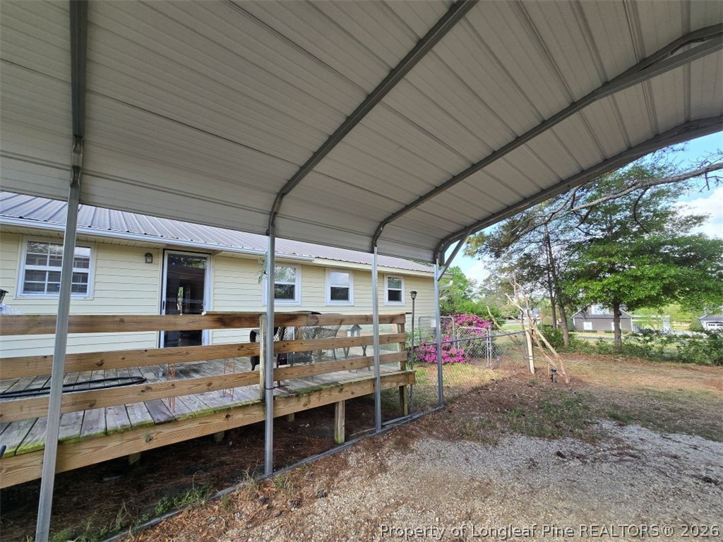 219 East Clinton Street Autryville, NC 28318 - Photo 27 of 32 a view of a porch with furniture and a backyard