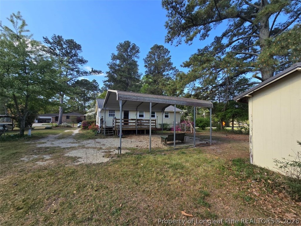 219 East Clinton Street Autryville, NC 28318 - Photo 29 of 32 a view of a house with a yard