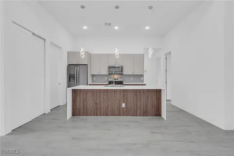 a view of kitchen with wooden floor