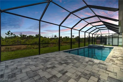 a view of swimming pool with a back yard