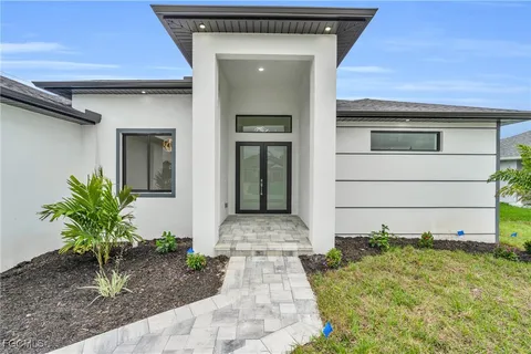 a front view of a house with garage