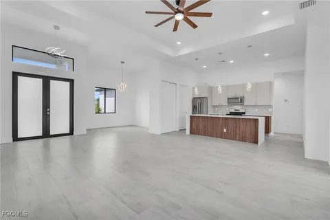 a view of a kitchen with a sink and a window