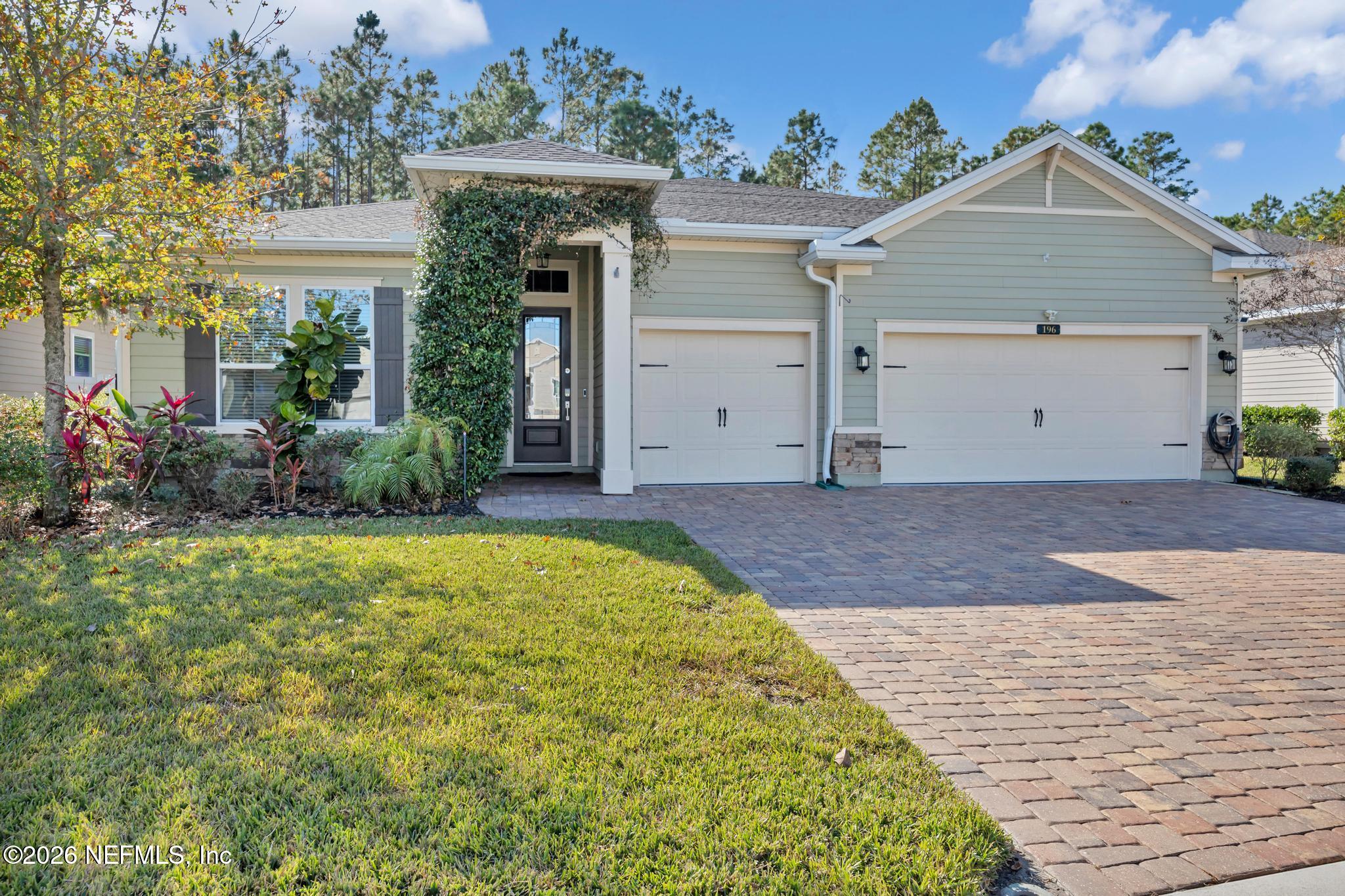 196 Silver Reef Lane St. Augustine, FL 32095 - Photo 1 of 62 a front view of a house with garden