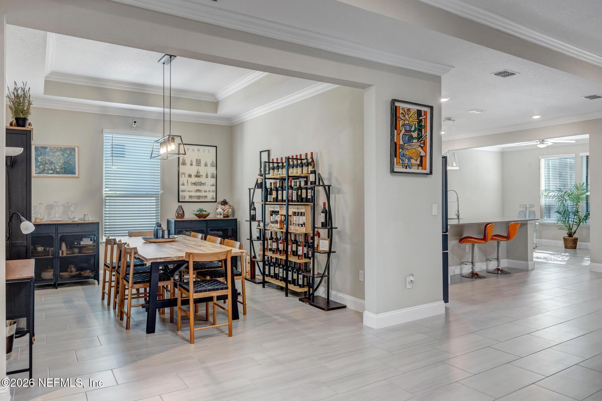 196 Silver Reef Lane St. Augustine, FL 32095 - Photo 12 of 62 a view of a dining room with furniture and chandelier