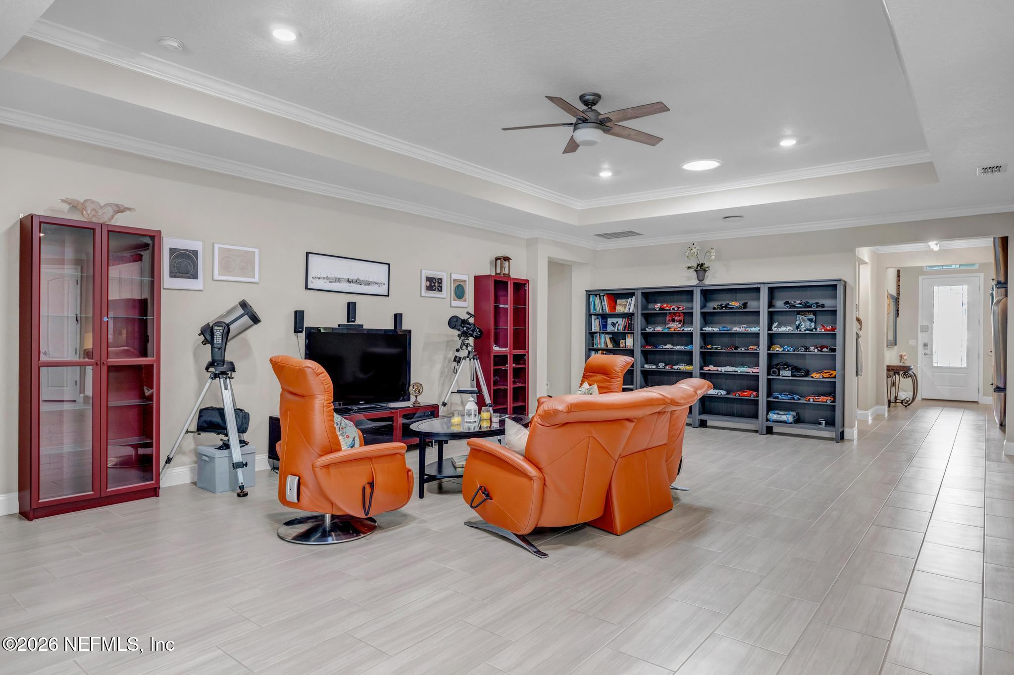 196 Silver Reef Lane St. Augustine, FL 32095 - Photo 13 of 62 a living room with furniture and a flat screen tv
