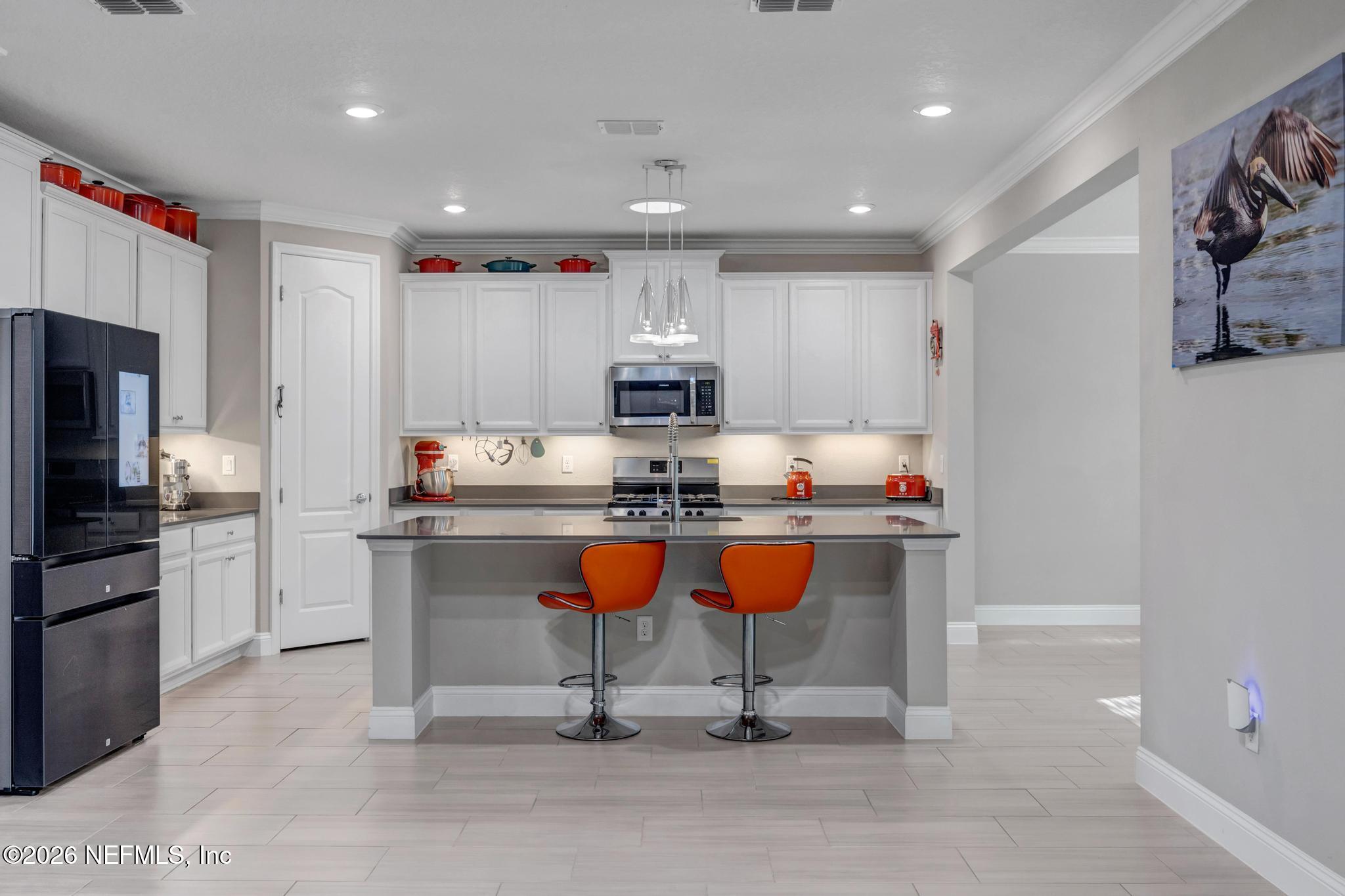 196 Silver Reef Lane St. Augustine, FL 32095 - Photo 17 of 62 a kitchen with granite countertop a sink and stainless steel appliances