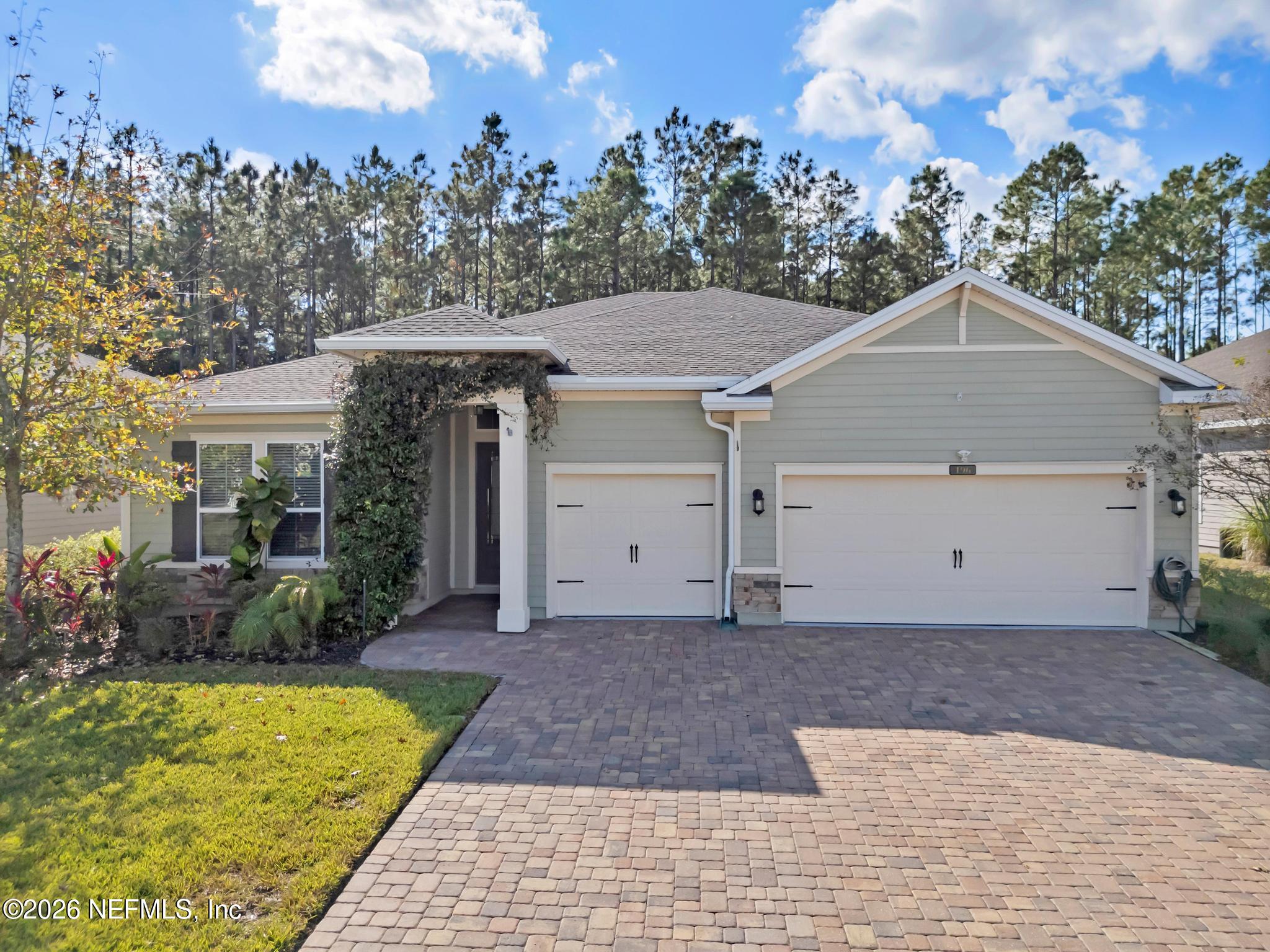 196 Silver Reef Lane St. Augustine, FL 32095 - Photo 2 of 62 a front view of a house with garden