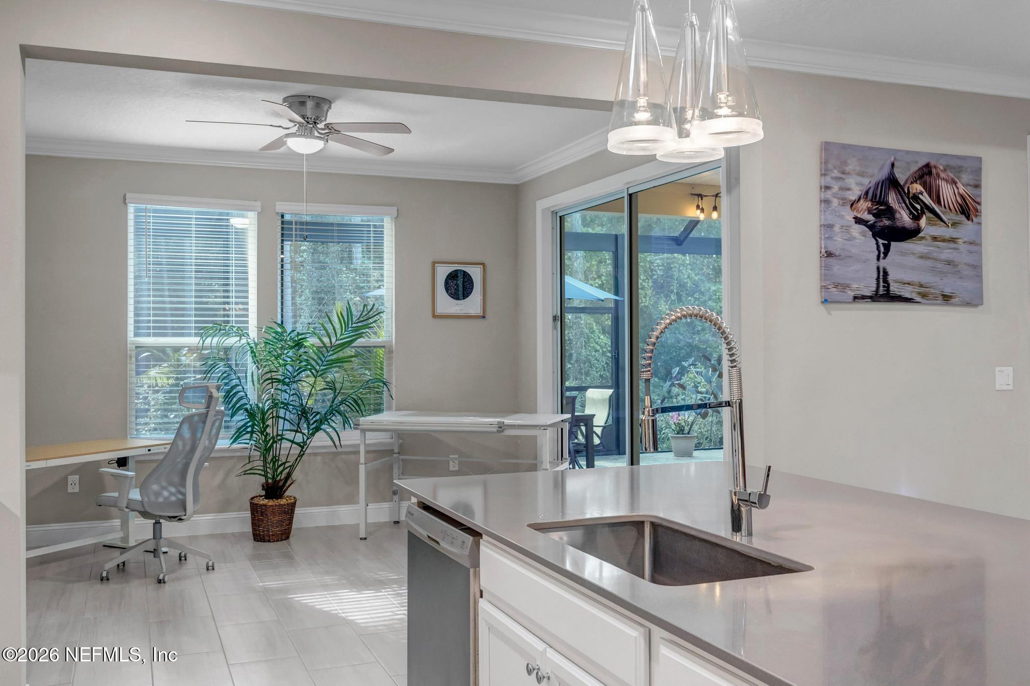 196 Silver Reef Lane St. Augustine, FL 32095 - Photo 21 of 62 a kitchen with a sink and chandelier